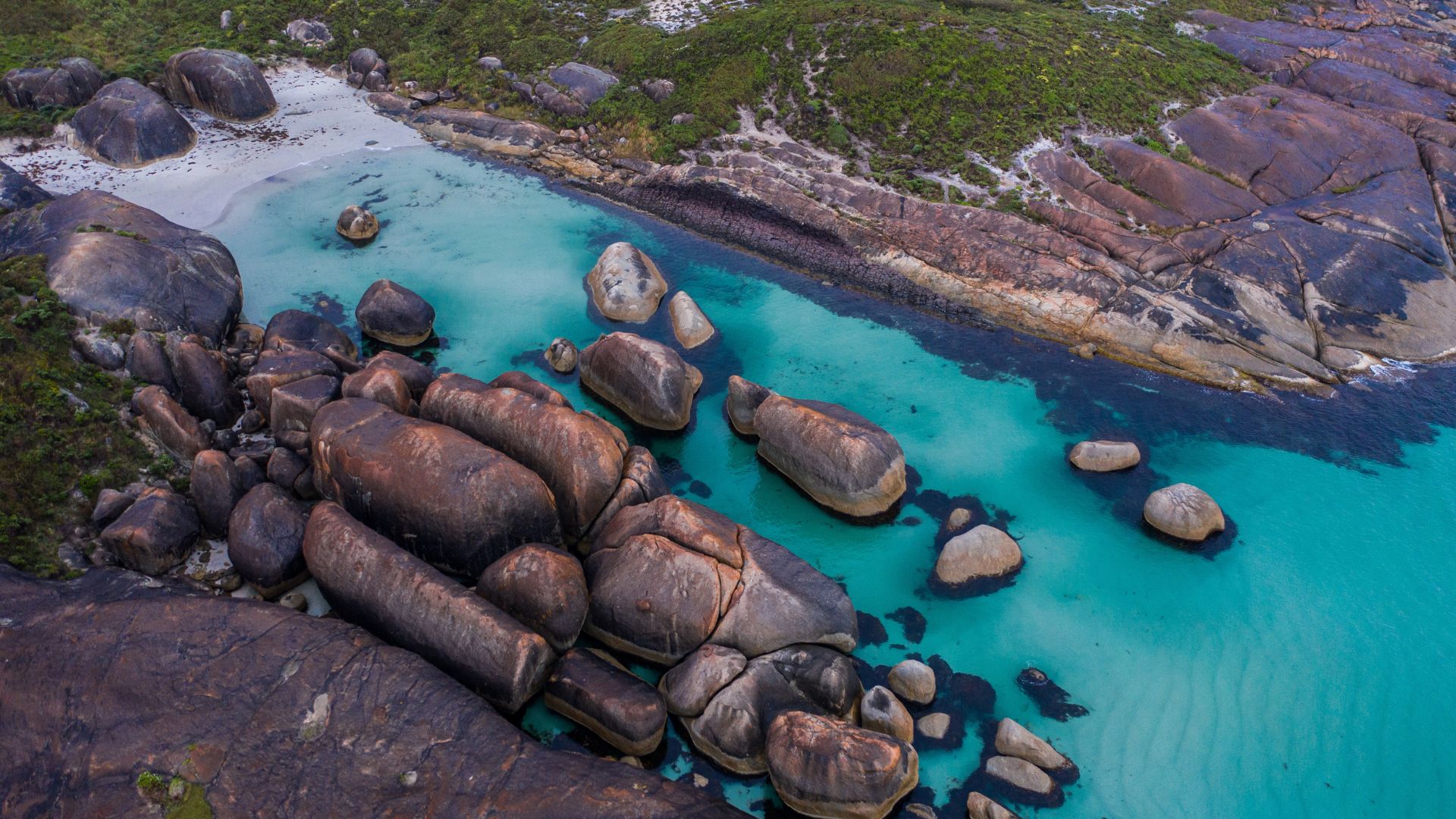 Aerial view of a beach with giant boulders that look like the shape of elephants, located near Denmark in Southwest Western Australia